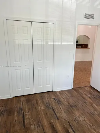 a view of a livingroom with wooden floor