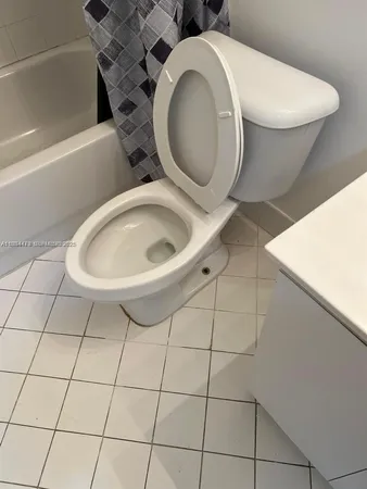 a bathroom with a toilet and a sink