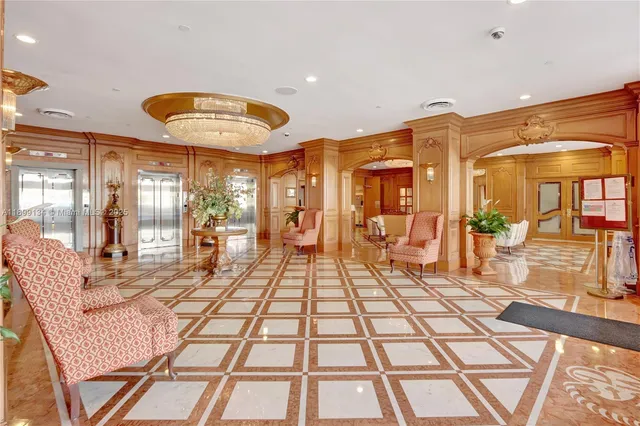 a living room with a black white checkered floor with a large kitchen view