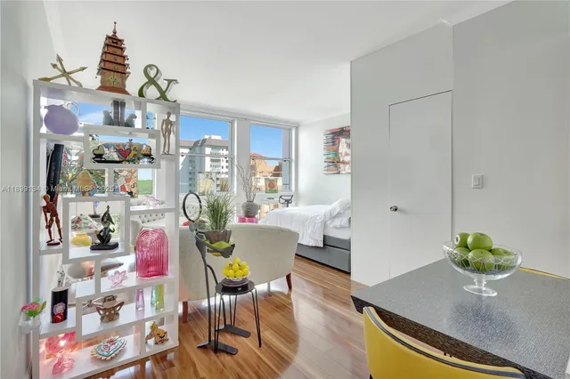 a living room with furniture and flowers