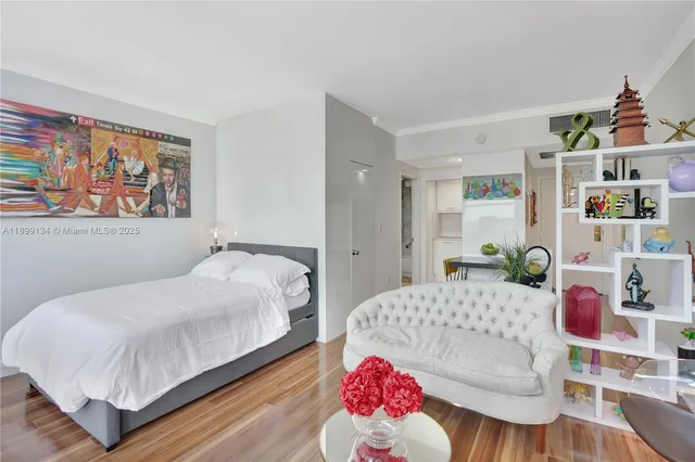 a bedroom with a bed and a couch