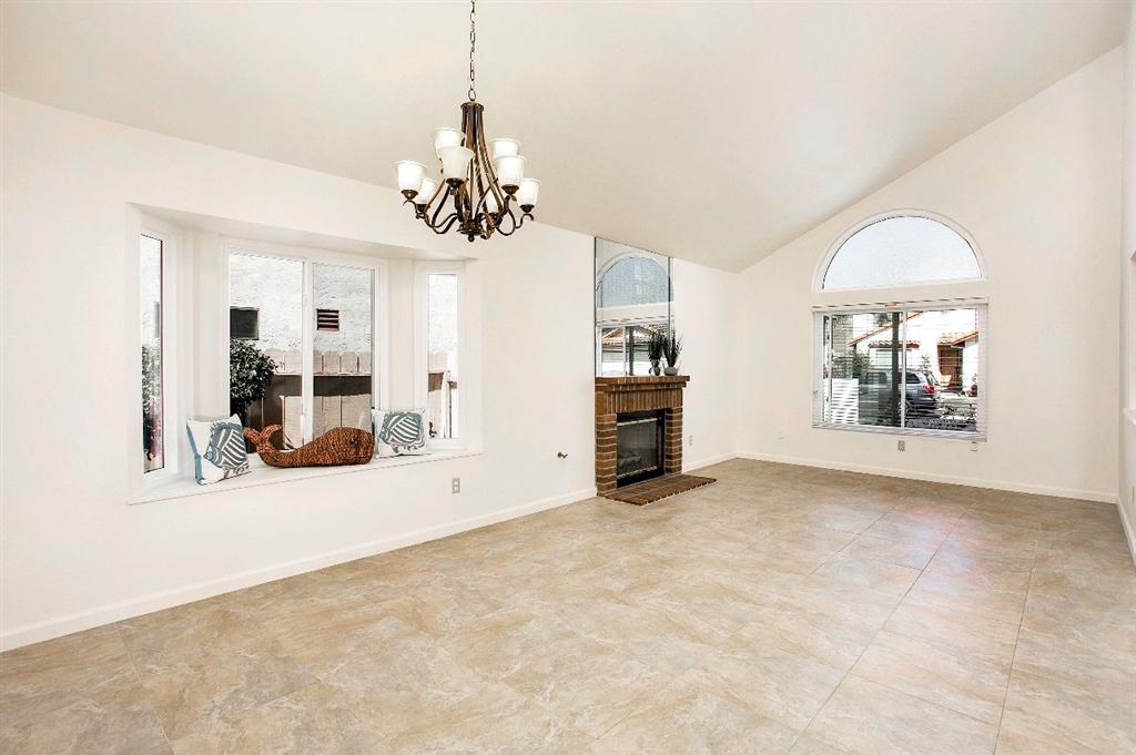 1980 Paseo Del Rey Vista, CA 92084 - Photo 6 of 25 a view of a livingroom with a furniture a chandelier and a large window