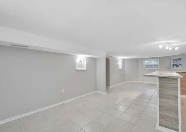 a view of kitchen and windows