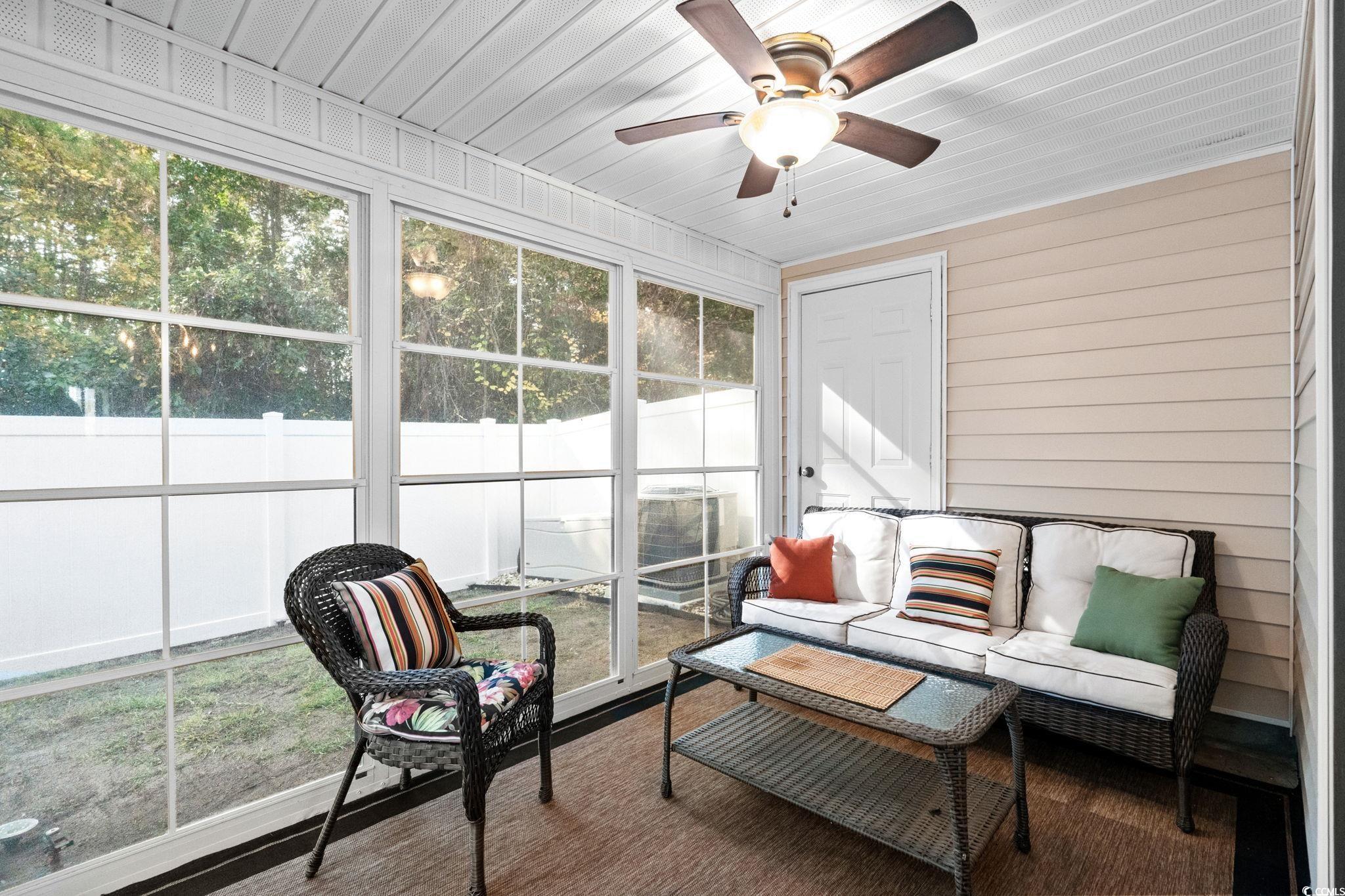 399 Seabert Road, Unit 209 Myrtle Beach, SC 29579 - Photo 20 of 40 Sunroom / solarium featuring an outdoor hangout area and ceiling fan