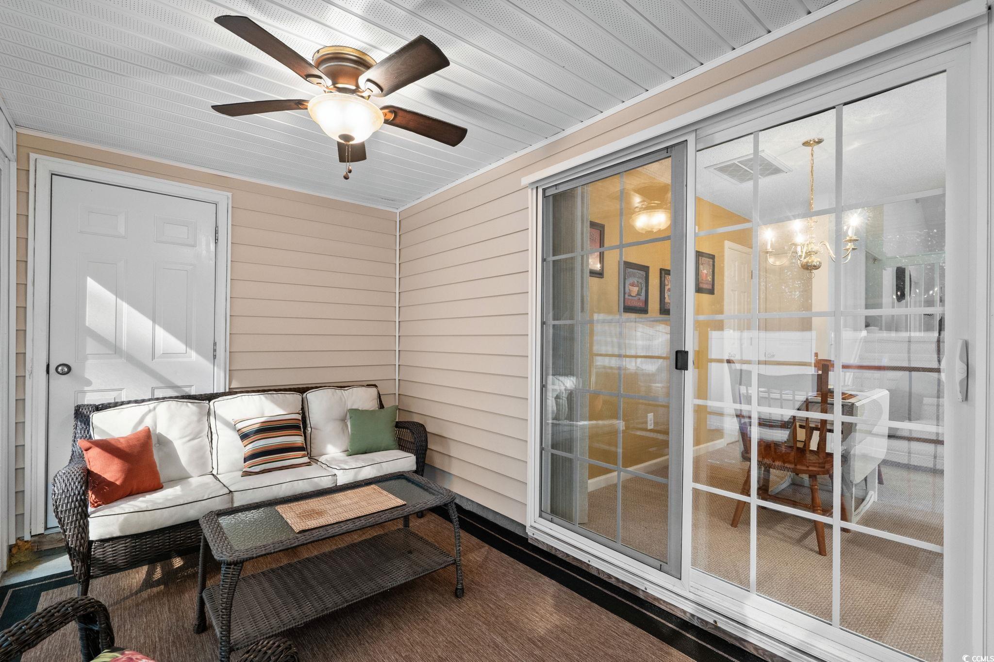 399 Seabert Road, Unit 209 Myrtle Beach, SC 29579 - Photo 21 of 40 Sunroom / solarium featuring a ceiling fan