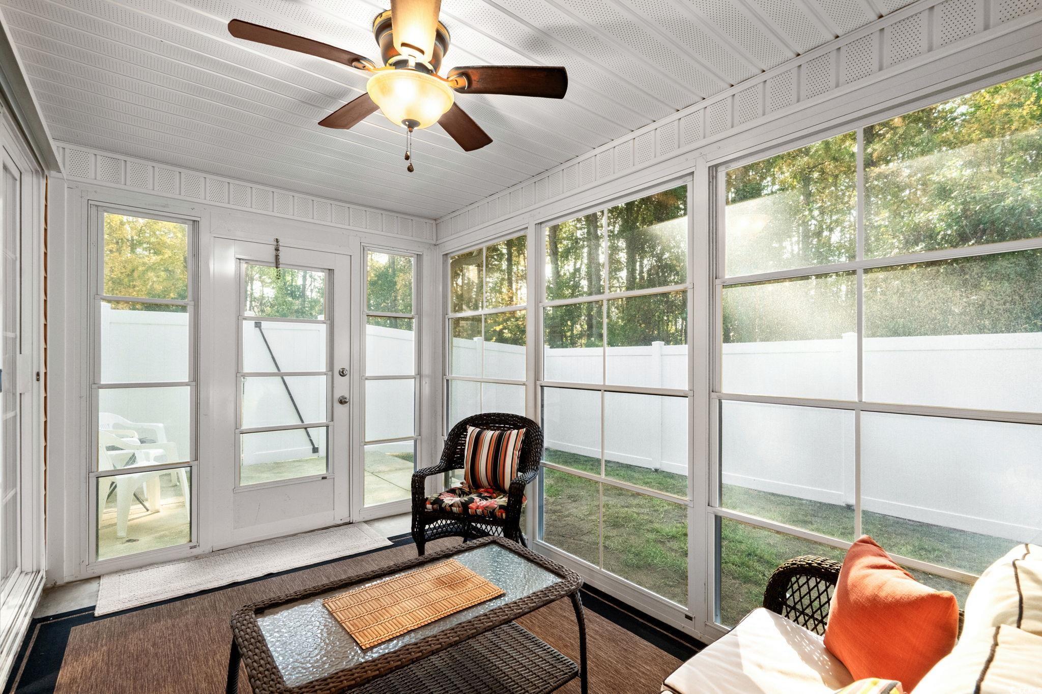399 Seabert Road, Unit 209 Myrtle Beach, SC 29579 - Photo 22 of 40 Sunroom with a ceiling fan and outdoor lounge area