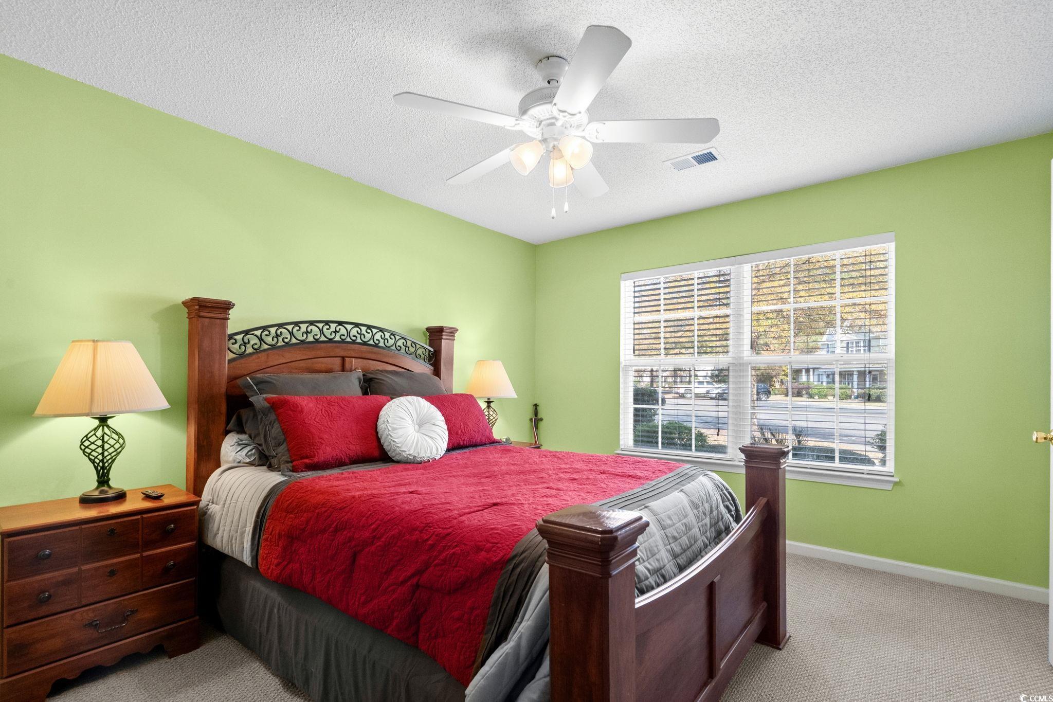 399 Seabert Road, Unit 209 Myrtle Beach, SC 29579 - Photo 26 of 40 Carpeted bedroom featuring a textured ceiling and ceiling fan
