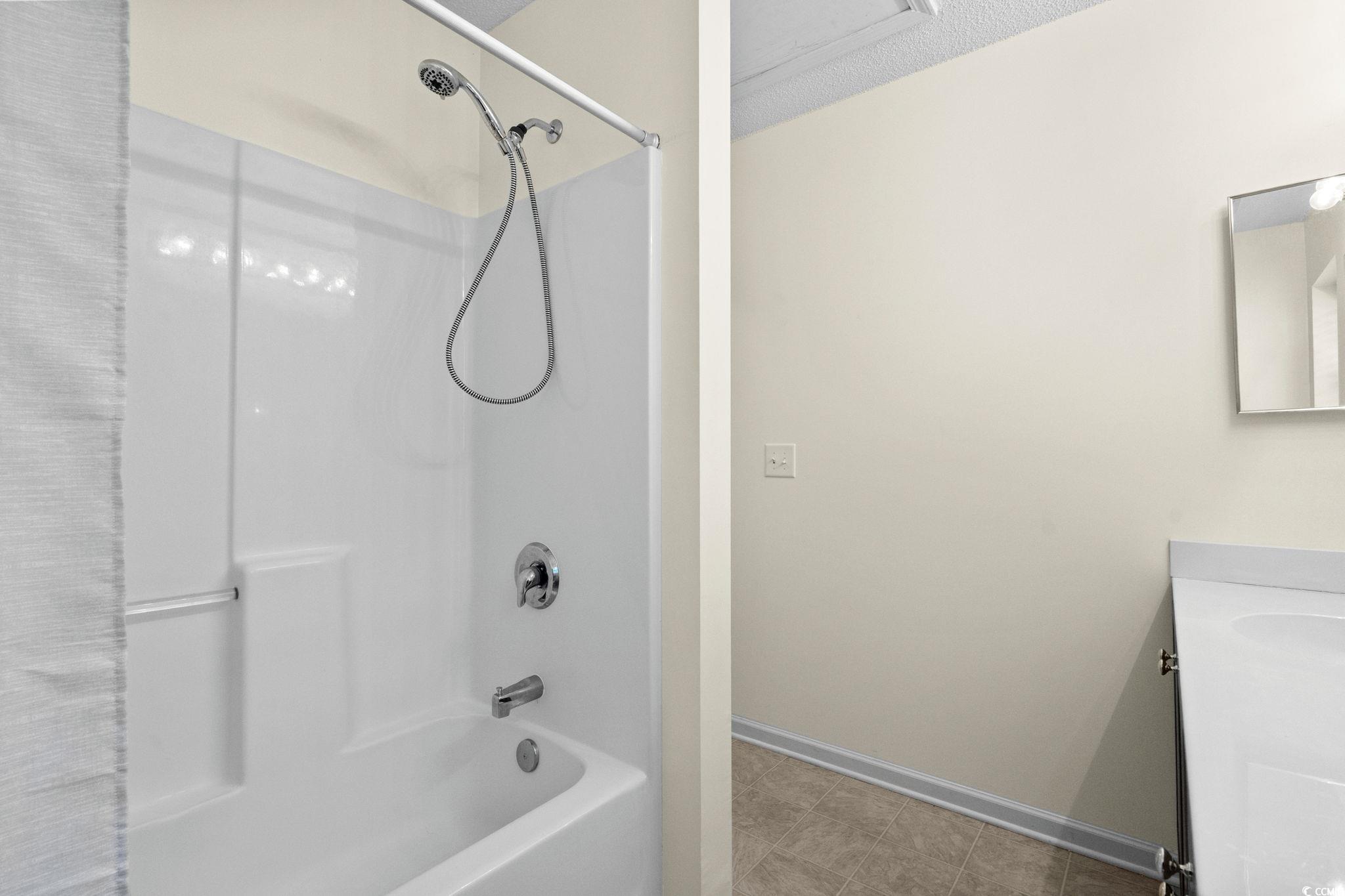 399 Seabert Road, Unit 209 Myrtle Beach, SC 29579 - Photo 32 of 40 Full bathroom with tub / shower combination and vanity