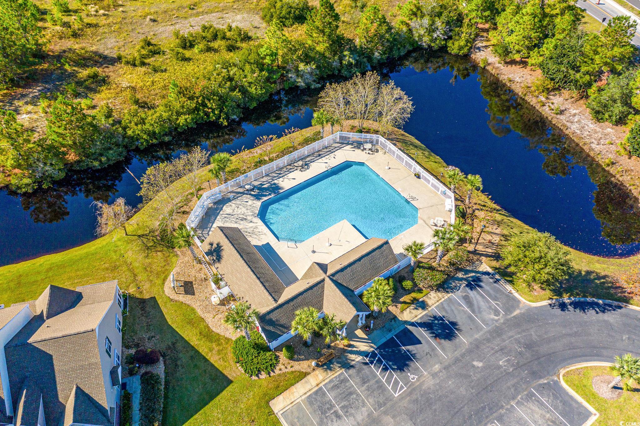 399 Seabert Road, Unit 209 Myrtle Beach, SC 29579 - Photo 38 of 40 Bird's eye view of a pool area and a large body of water