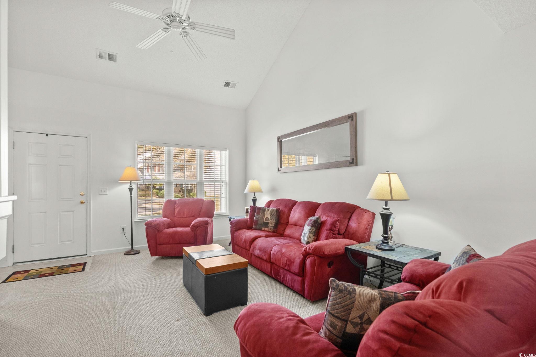 399 Seabert Road, Unit 209 Myrtle Beach, SC 29579 - Photo 8 of 40 Living area with carpet, high vaulted ceiling, and a ceiling fan