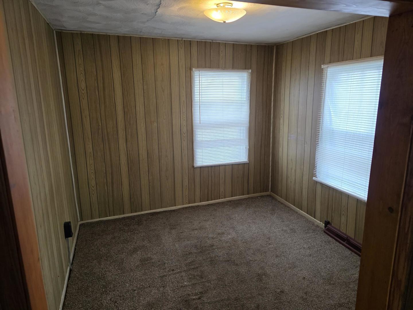 2203 Deets Road Sterling, IL 61081 - Photo 11 of 13 a view of an empty room and window