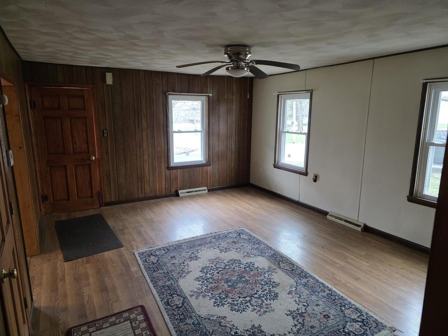 2203 Deets Road Sterling, IL 61081 - Photo 6 of 13 a view of a livingroom with wooden floor and window