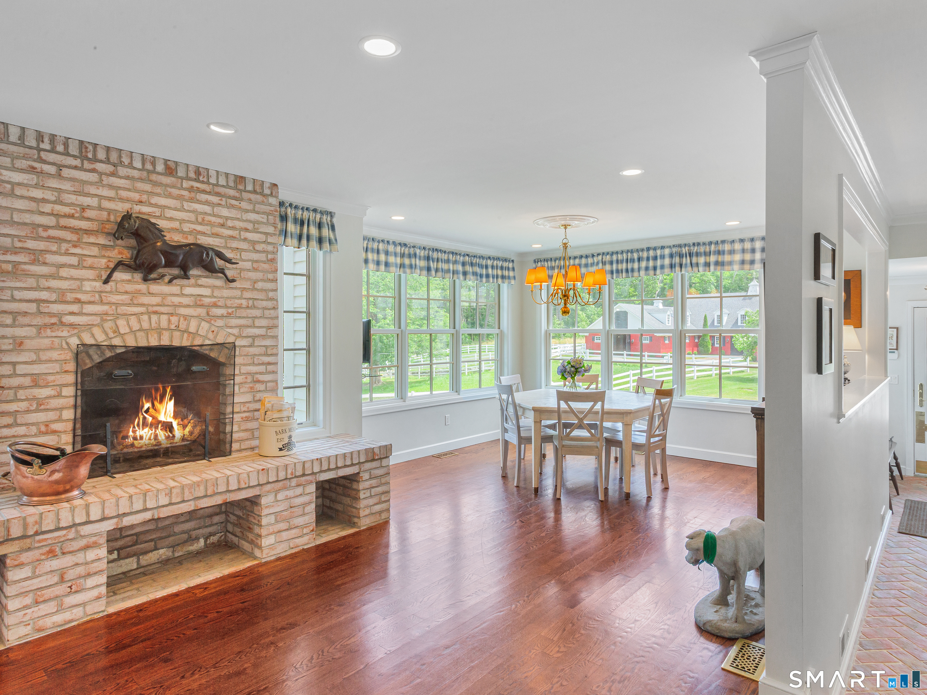 433 Wrights Crossing Road Pomfret Center, CT 06259 - Photo 17 of 40 Brick wood burning fireplace connects the eating space with the kitchen