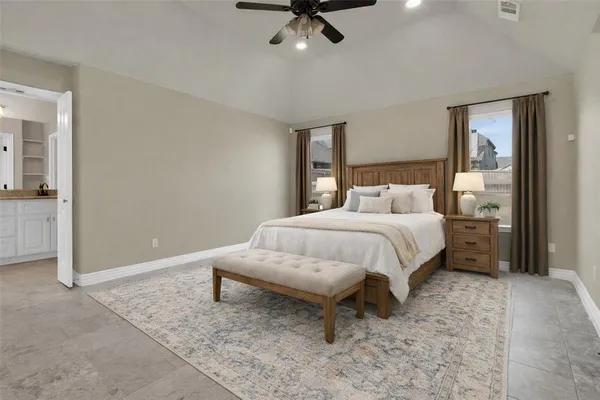 a bed room with a bed and a chandelier