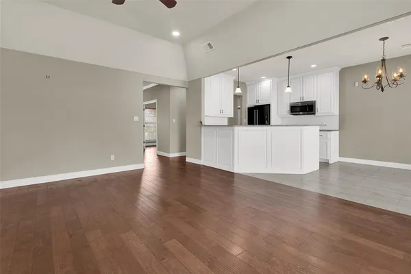 a view of a kitchen with a sink and a stove top oven