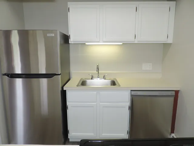 a utility room with washing machine