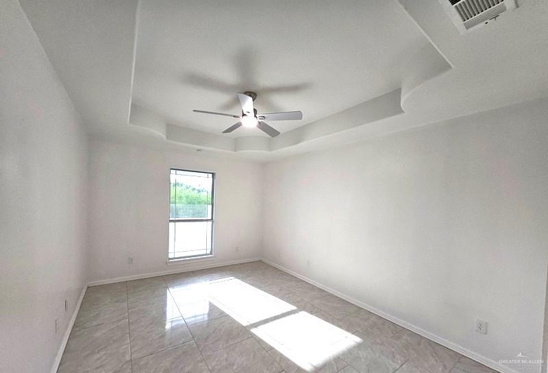 6720 North 4th Street McAllen, TX 78504 - Photo 11 of 25 an empty room with windows and fan