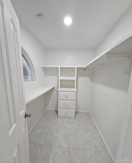 6720 North 4th Street McAllen, TX 78504 - Photo 14 of 25 a view of an empty walk in closet