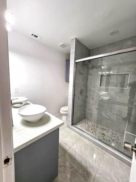 6720 North 4th Street McAllen, TX 78504 - Photo 16 of 25 a bathroom with a sink and a mirror