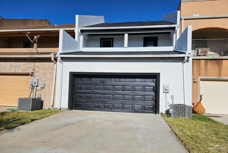 6720 North 4th Street McAllen, TX 78504 - Photo 20 of 25 a front view of a house with a garage