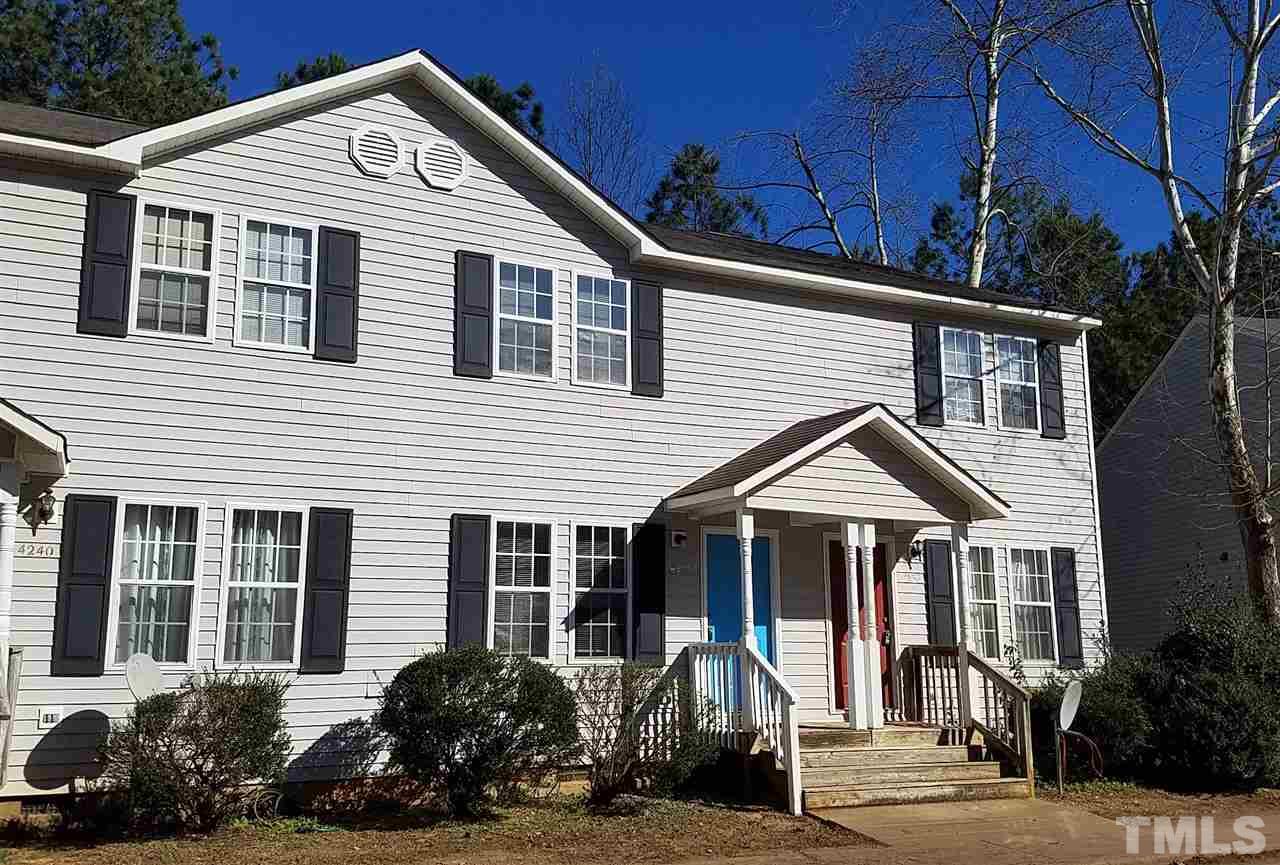 4238 Kaplan Drive Raleigh, NC 27606 - Photo 2 of 21 a front view of a house with a yard