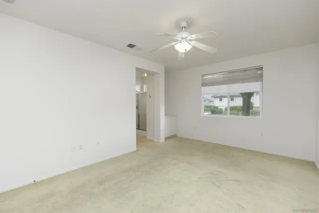 an empty room with a bathroom