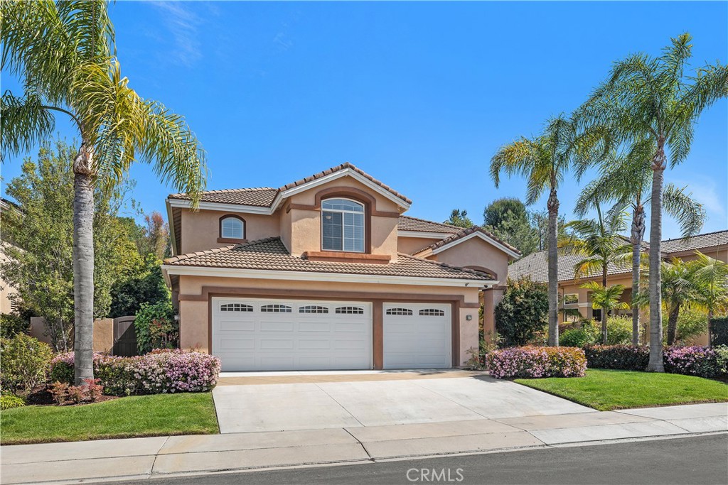 27 Hawk Hill Mission Viejo, CA 92692 - Photo 1 of 48 a front view of a house with a garden