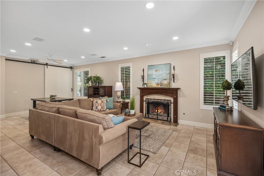 27 Hawk Hill Mission Viejo, CA 92692 - Photo 17 of 48 a living room with furniture and a fireplace