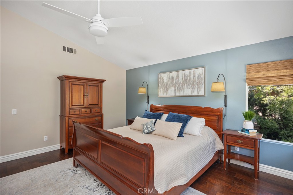 27 Hawk Hill Mission Viejo, CA 92692 - Photo 30 of 48 a bedroom with a bed a lamp and window