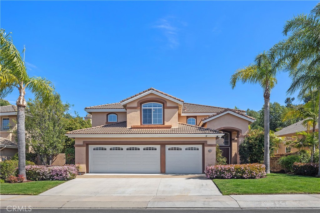 27 Hawk Hill Mission Viejo, CA 92692 - Photo 3 of 48 a front view of a house with a yard