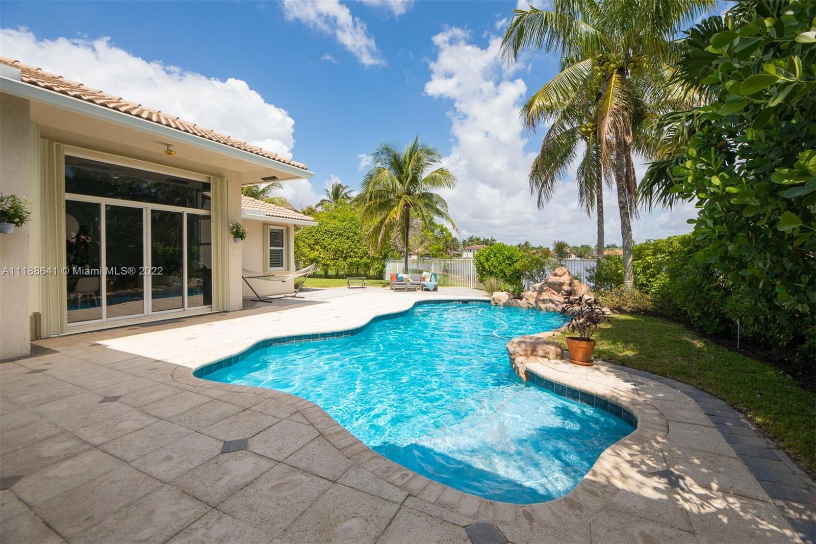 812 Regal Cove Road Weston, FL 33327 - Photo 1 of 64 a view of a backyard