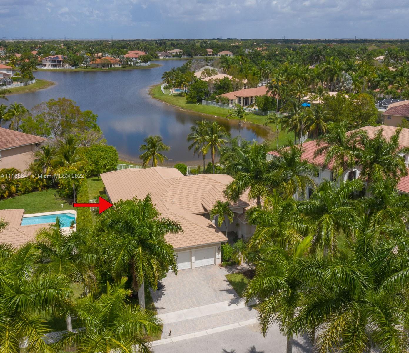 812 Regal Cove Road Weston, FL 33327 - Photo 13 of 64 an aerial view of residential house with outdoor space and lake view