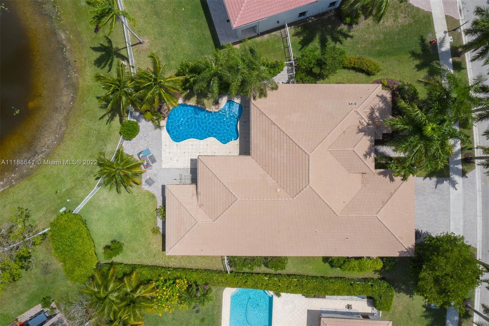 812 Regal Cove Road Weston, FL 33327 - Photo 18 of 64 an aerial view of a house with a yard