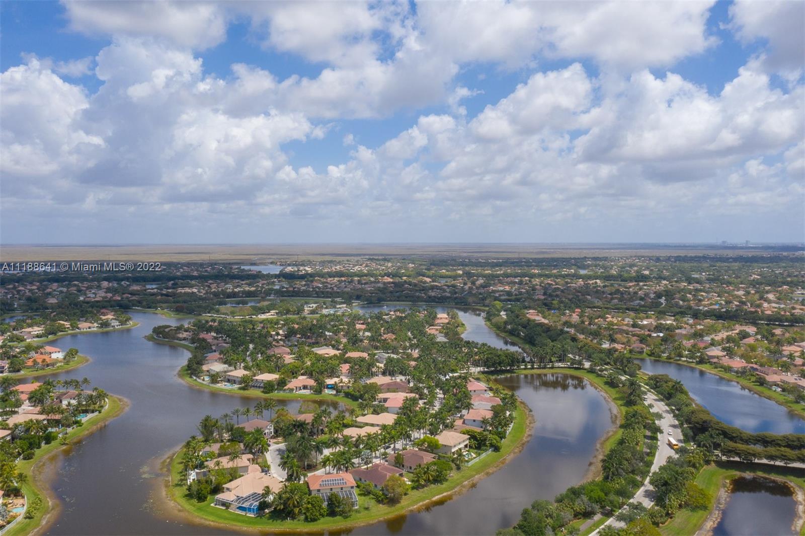 812 Regal Cove Road Weston, FL 33327 - Photo 21 of 64 an aerial view of residential houses with outdoor space
