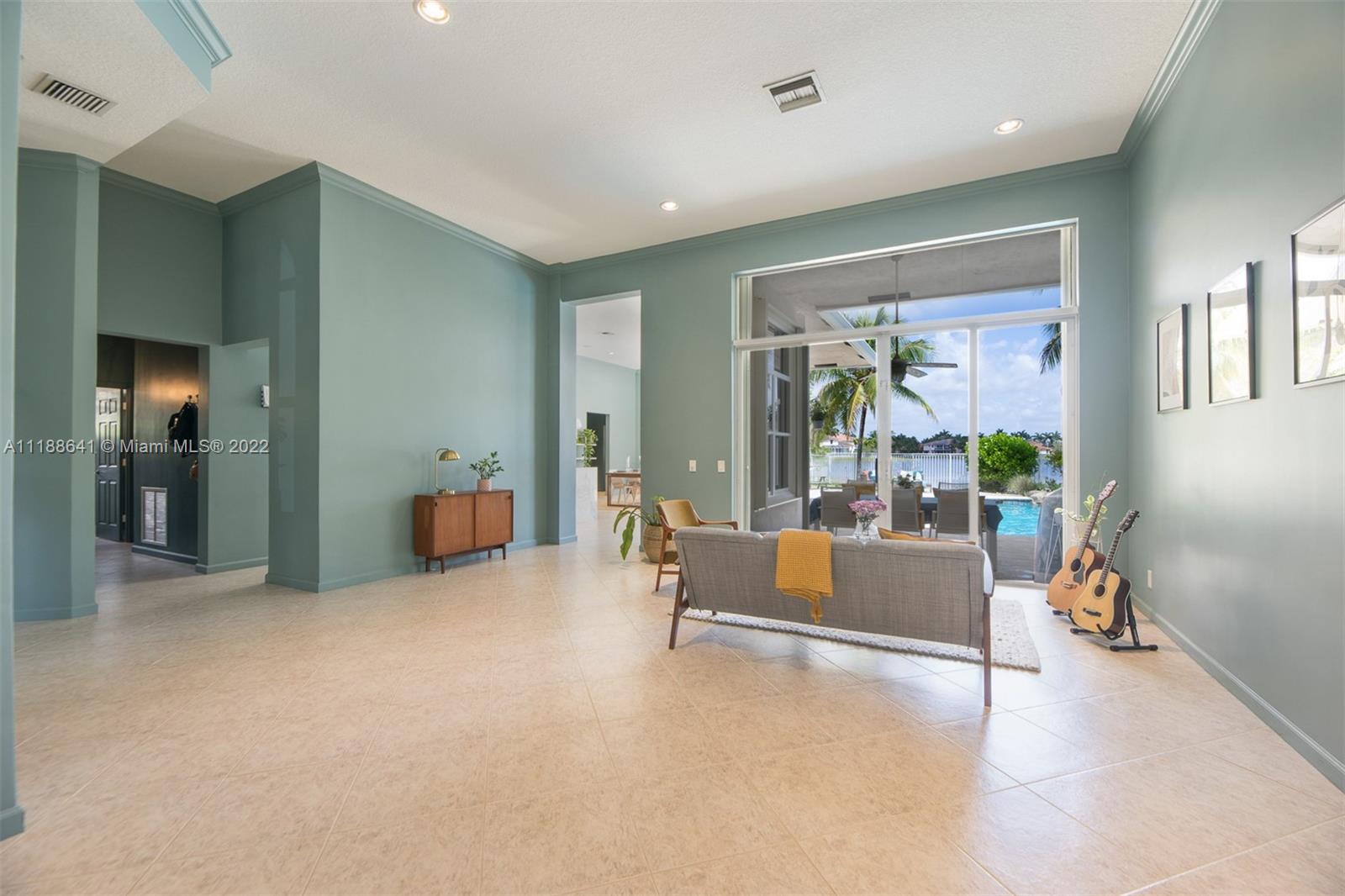 812 Regal Cove Road Weston, FL 33327 - Photo 31 of 64 a living room with furniture and a large window