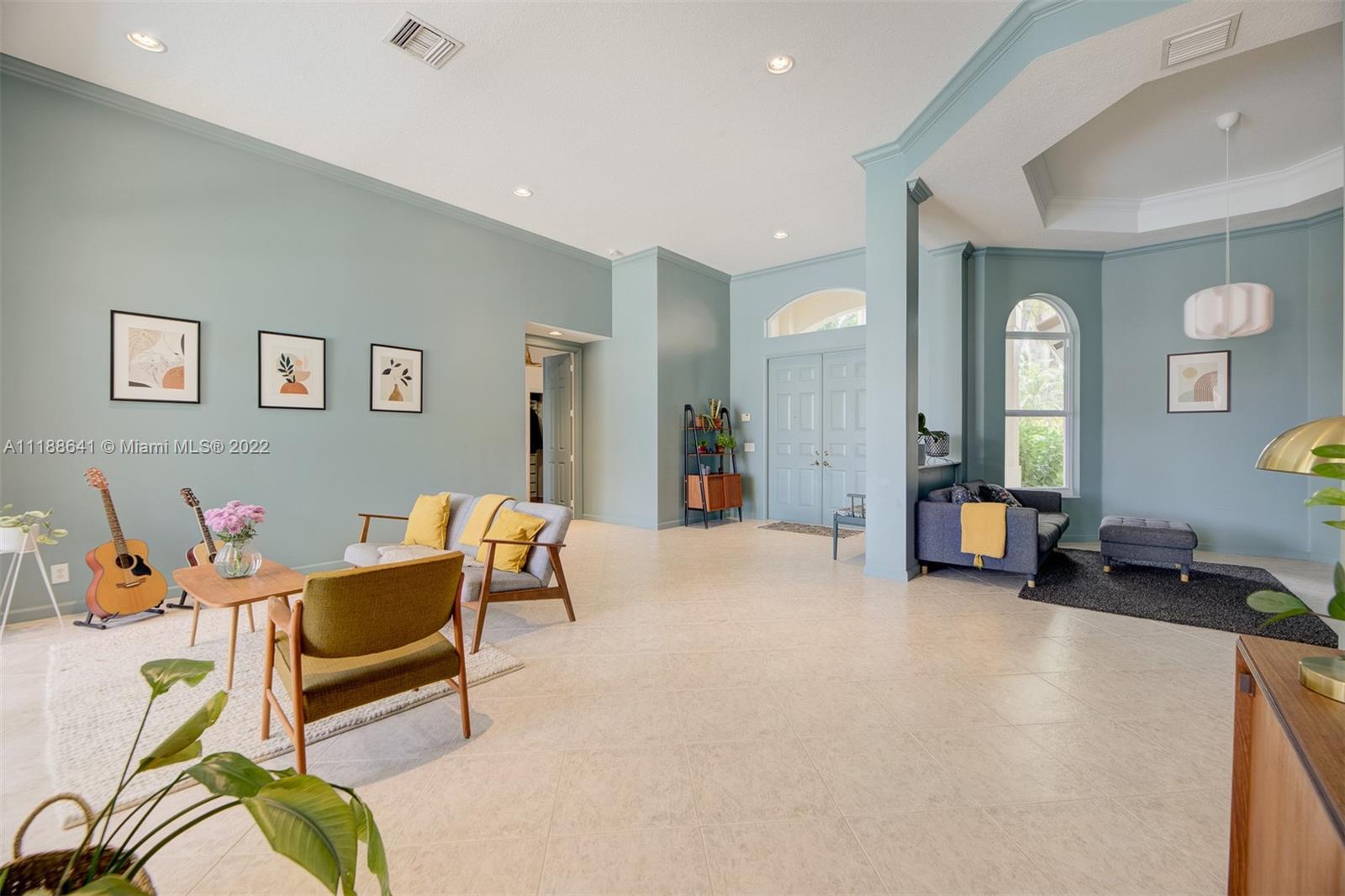812 Regal Cove Road Weston, FL 33327 - Photo 33 of 64 a living room with furniture and dining room