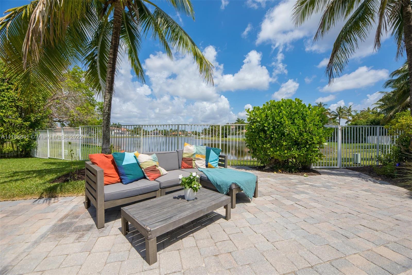812 Regal Cove Road Weston, FL 33327 - Photo 4 of 64 a view of a yard with furniture and a fire pit