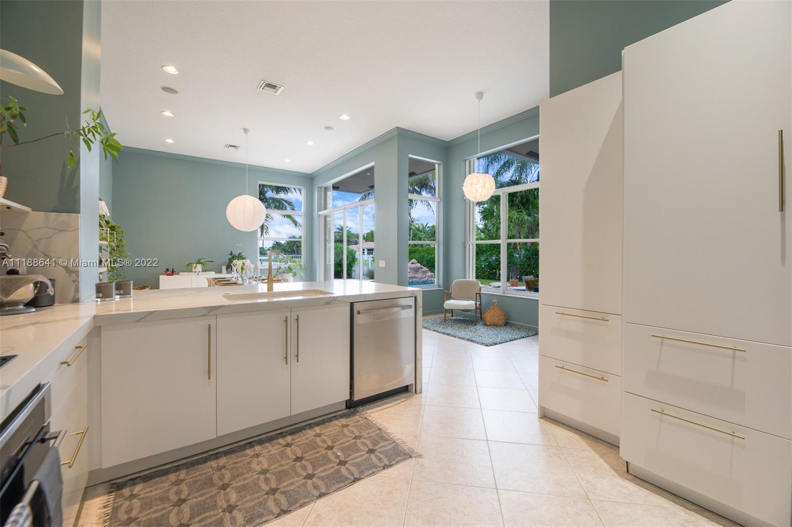 812 Regal Cove Road Weston, FL 33327 - Photo 44 of 64 a bathroom with a sink mirror and a bath tub
