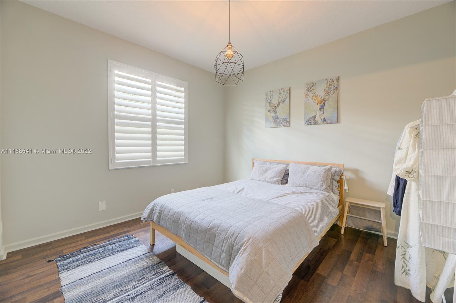 812 Regal Cove Road Weston, FL 33327 - Photo 55 of 64 a bedroom with a bed and a window