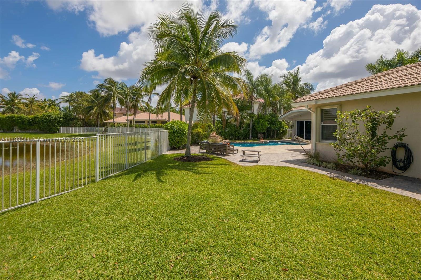 812 Regal Cove Road Weston, FL 33327 - Photo 6 of 64 a view of a swimming pool with a patio