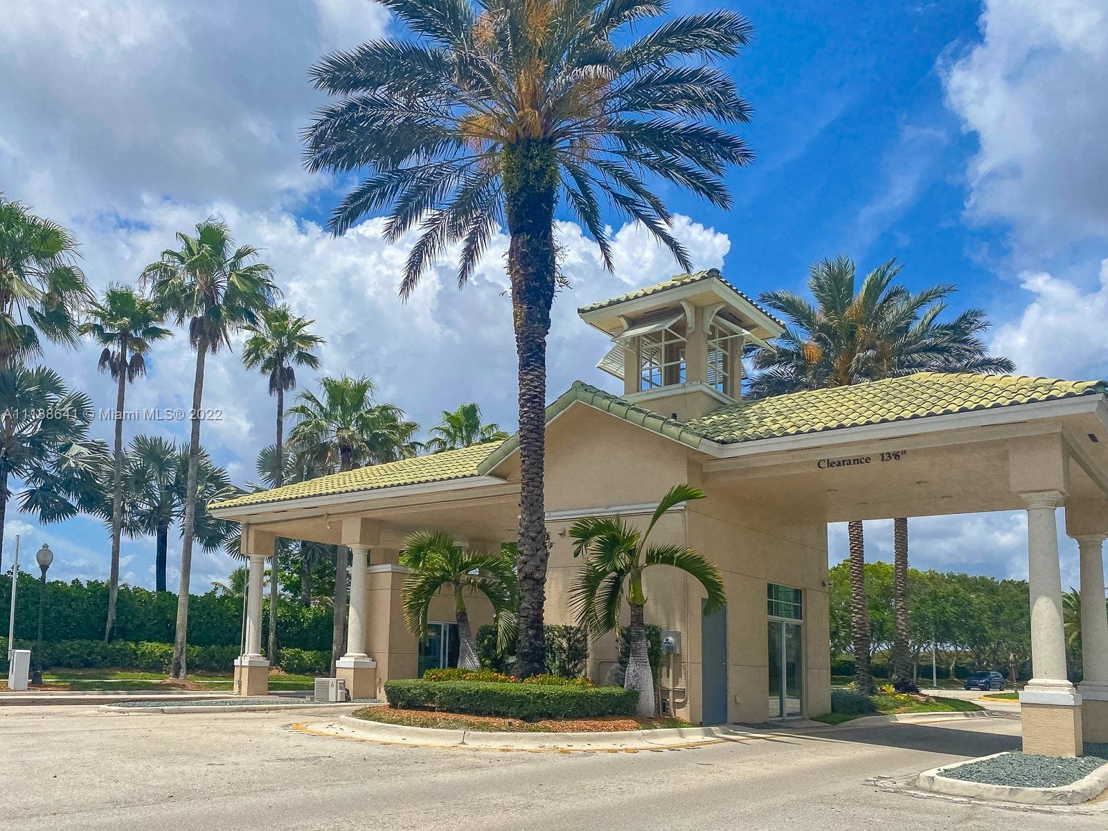 812 Regal Cove Road Weston, FL 33327 - Photo 64 of 64 a view of a building and a yard