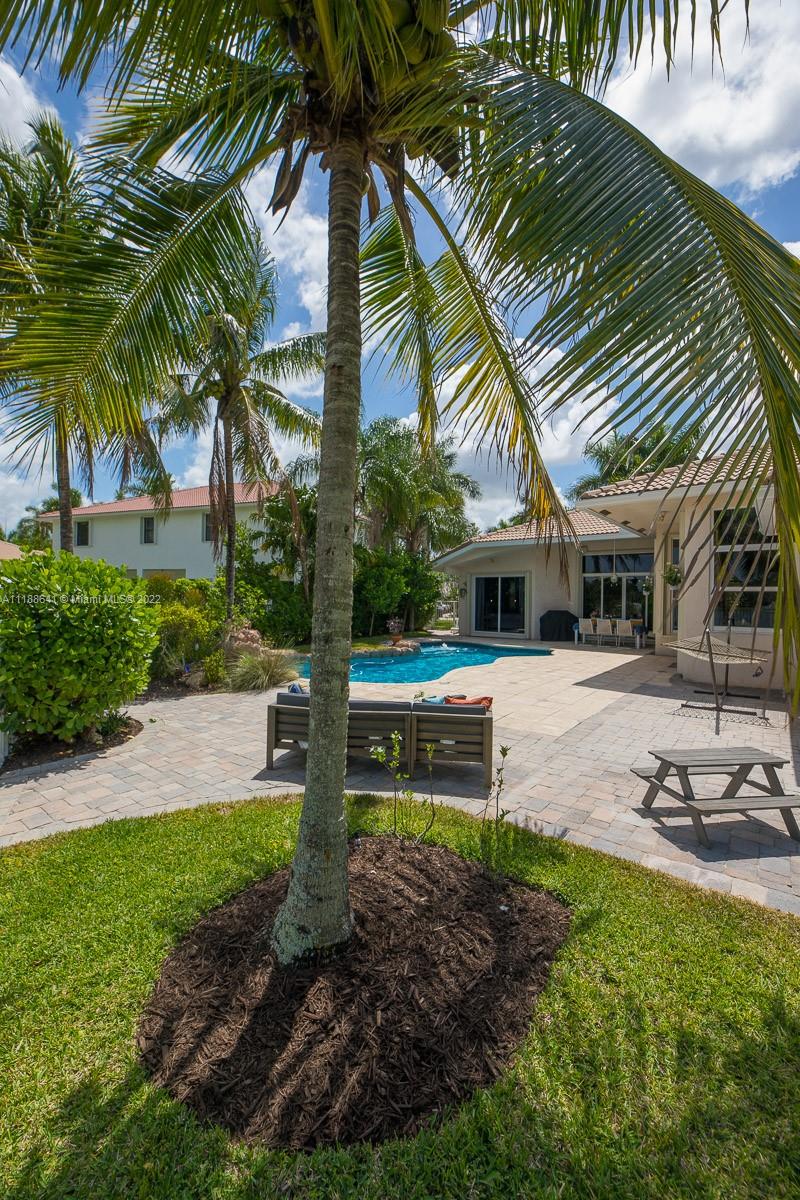 812 Regal Cove Road Weston, FL 33327 - Photo 7 of 64 a front view of a house with garden