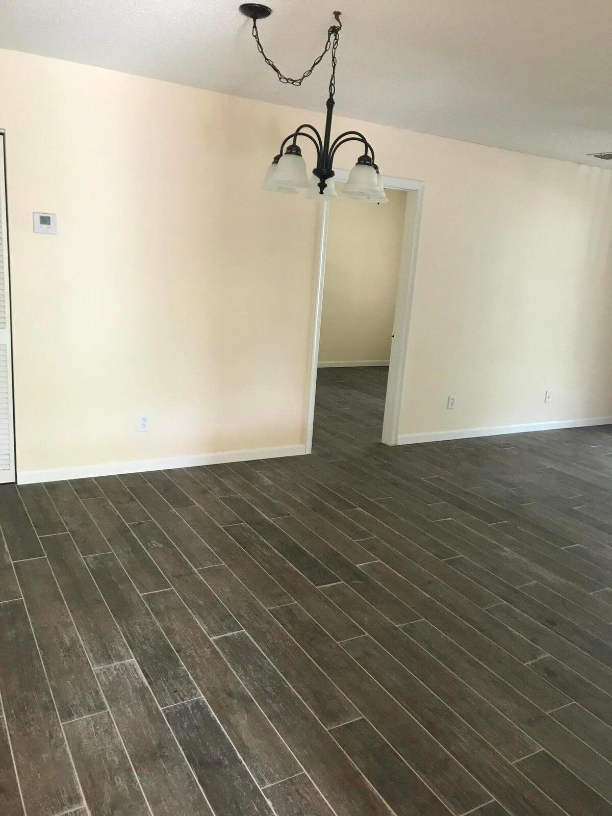 3629 Northwest 94th Avenue, Unit G5 Sunrise, FL 33351 - Photo 6 of 9 a view of a room with wooden floor