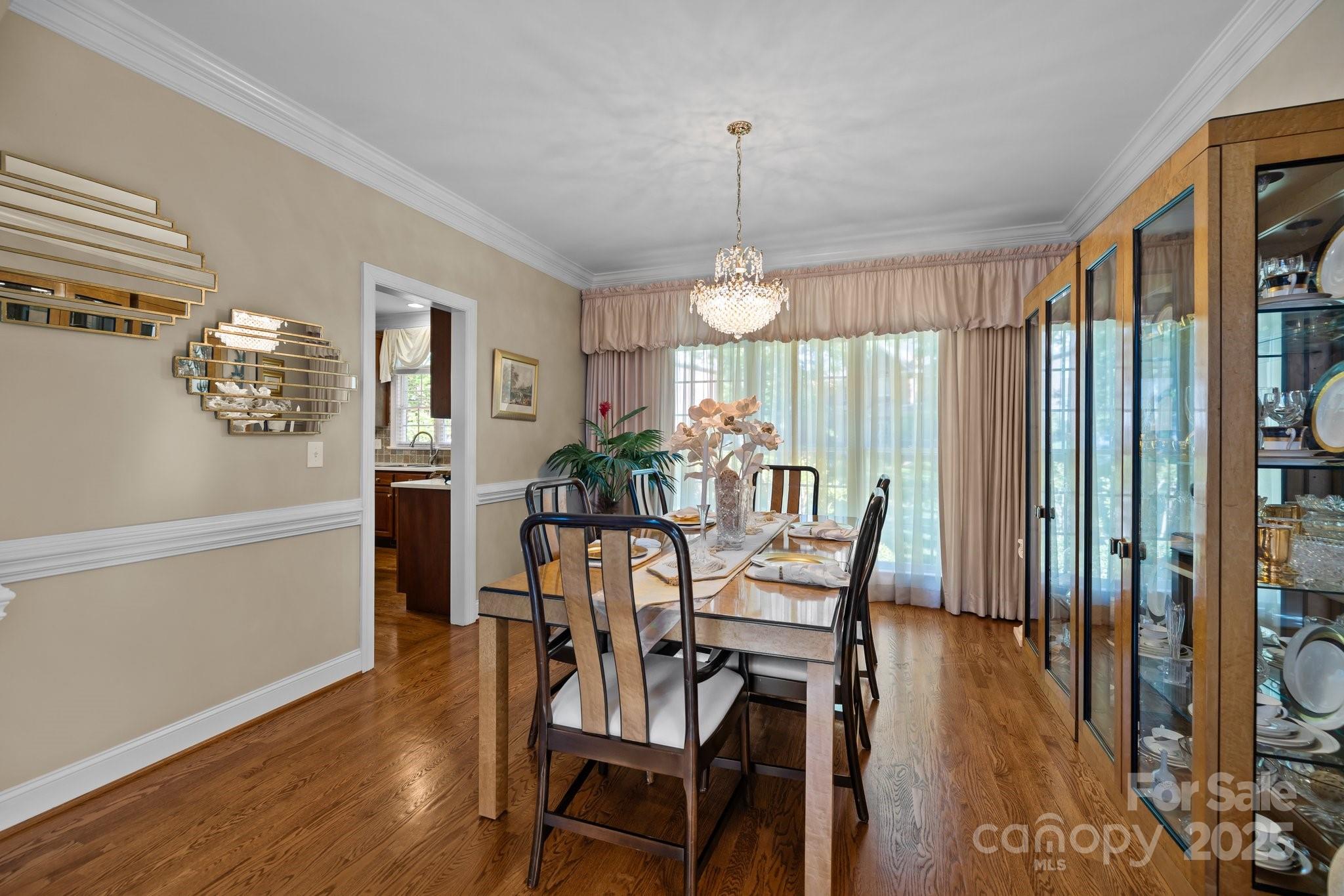 204 Limerick Drive Matthews, NC 28104 - Photo 11 of 44 a view of a dining room with furniture window and wooden floor