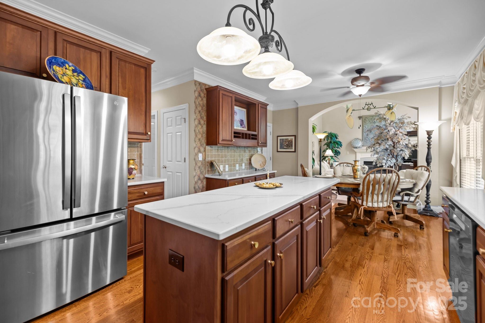 204 Limerick Drive Matthews, NC 28104 - Photo 17 of 44 a kitchen that has a lot of cabinets and wooden floor