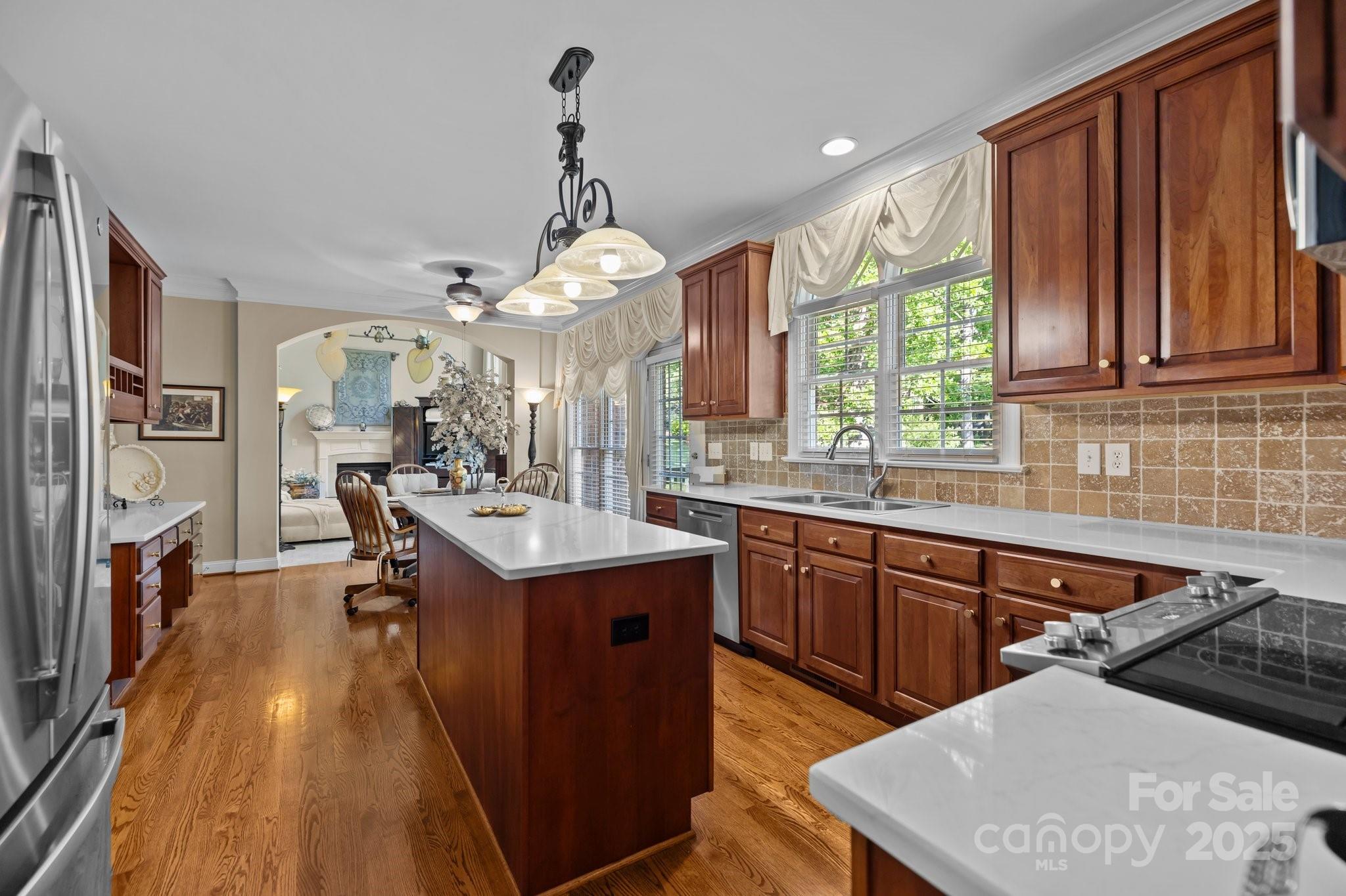204 Limerick Drive Matthews, NC 28104 - Photo 18 of 44 a kitchen with granite countertop a sink appliances and cabinets