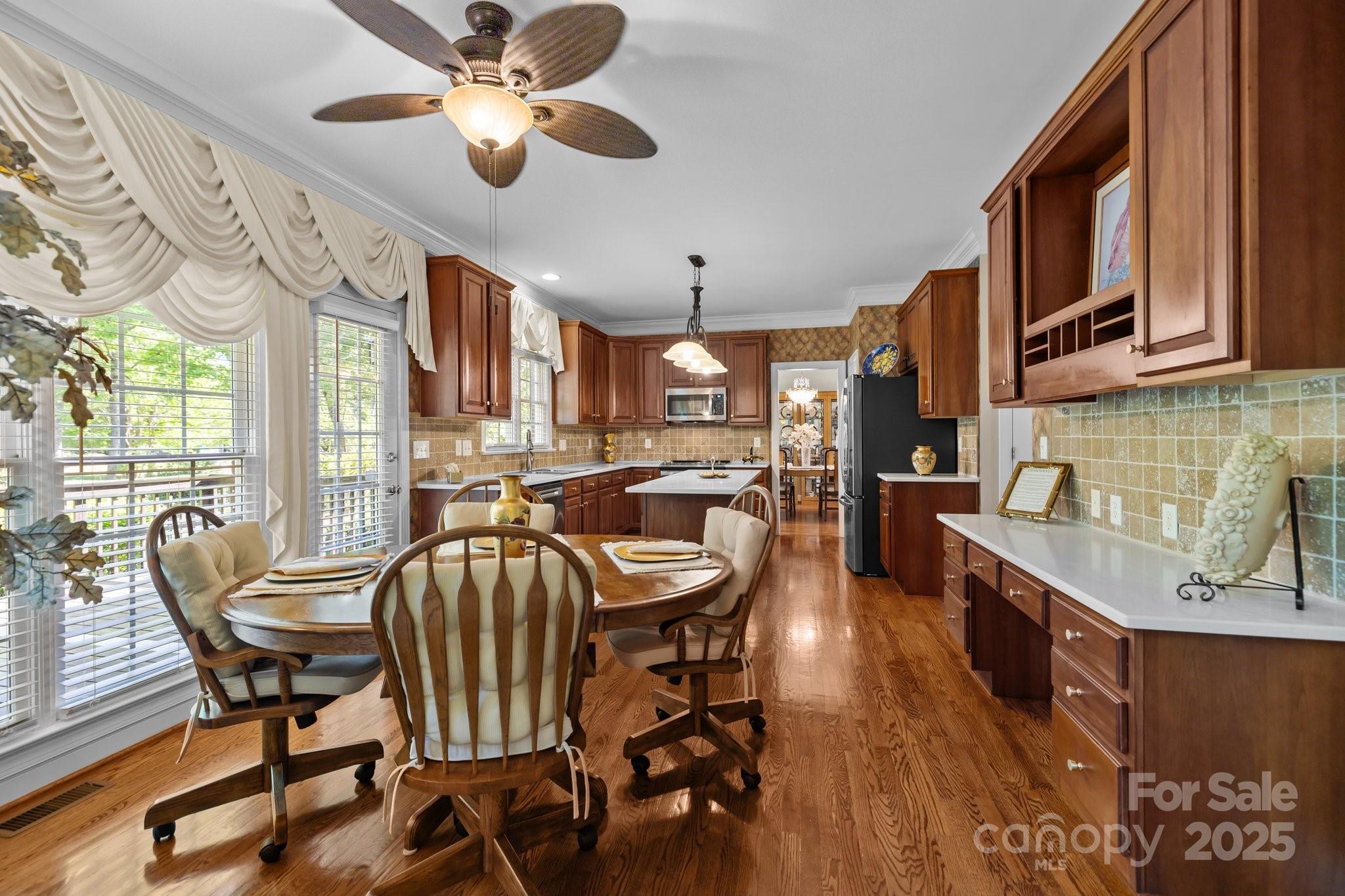204 Limerick Drive Matthews, NC 28104 - Photo 19 of 44 a view of a dining room with furniture window and wooden floor