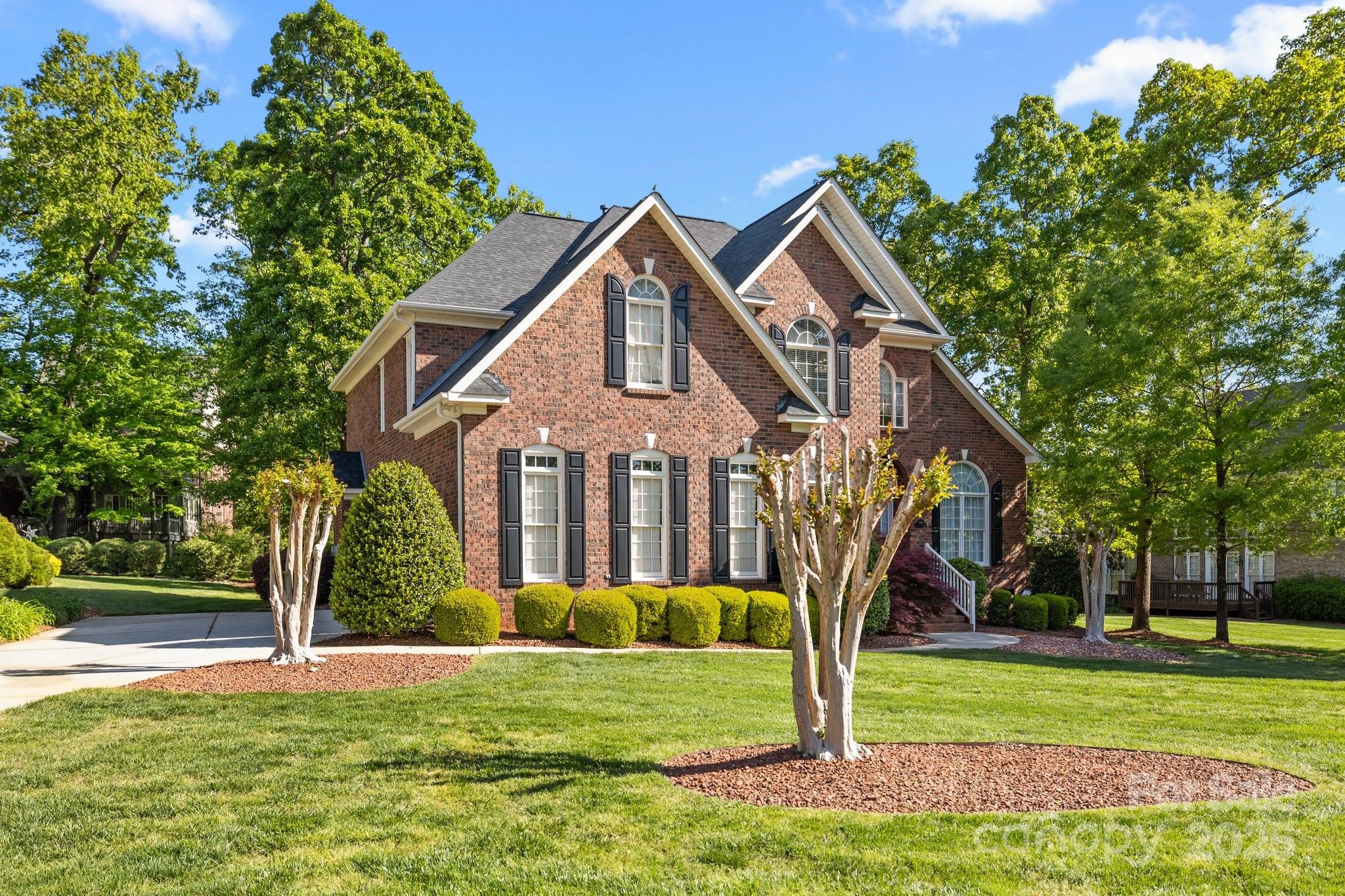 204 Limerick Drive Matthews, NC 28104 - Photo 2 of 44 a front view of a house with garden