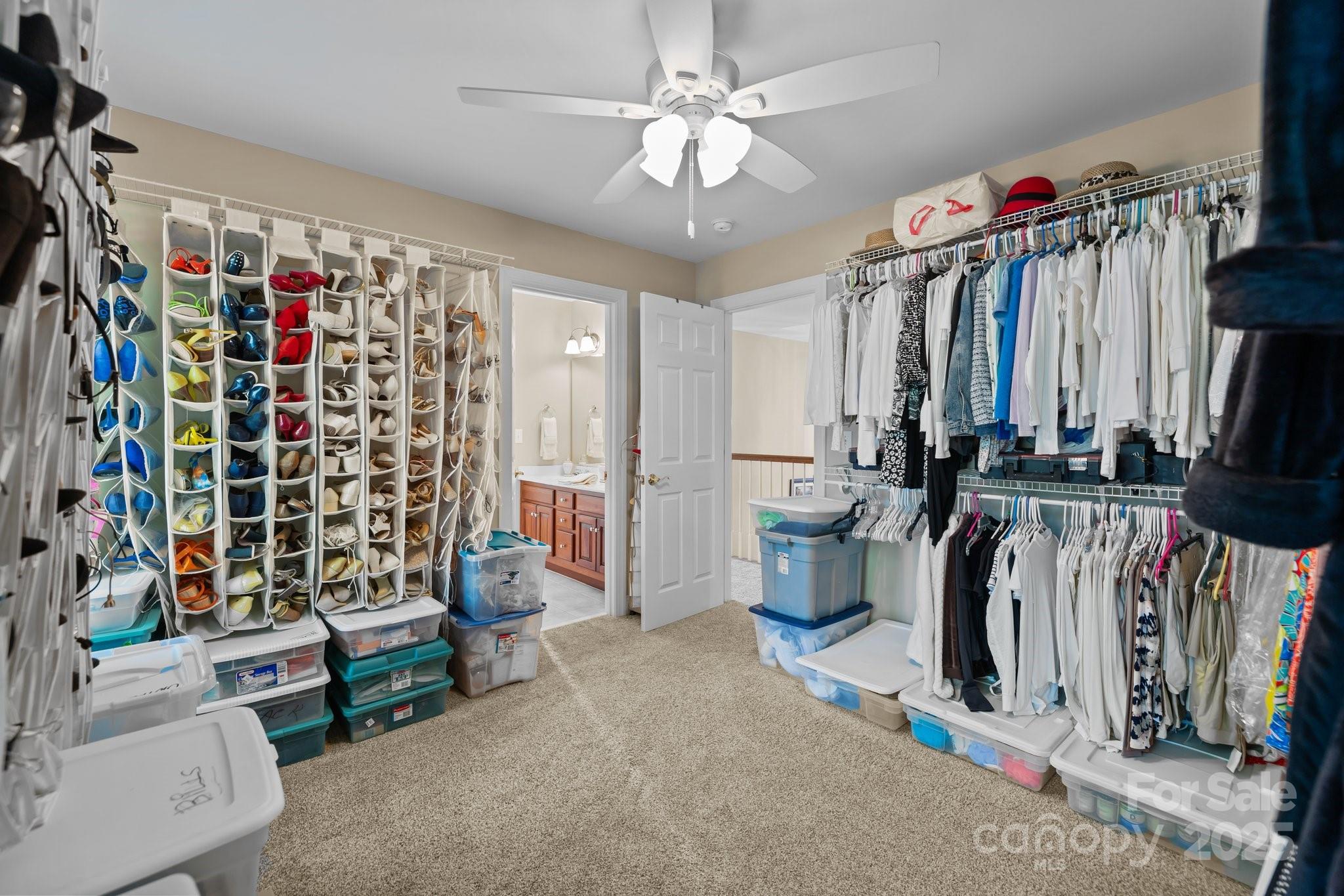 204 Limerick Drive Matthews, NC 28104 - Photo 28 of 44 a view of walk in closet with clothes and shoes