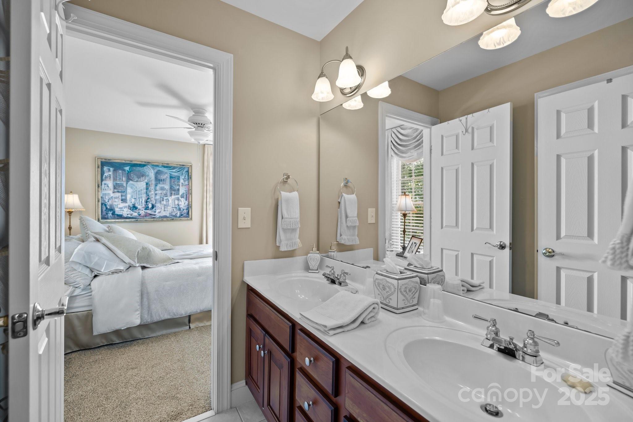 204 Limerick Drive Matthews, NC 28104 - Photo 29 of 44 a bathroom with a double vanity sink mirror and double